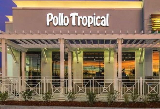 Pollo Tropical building with illuminated text signage